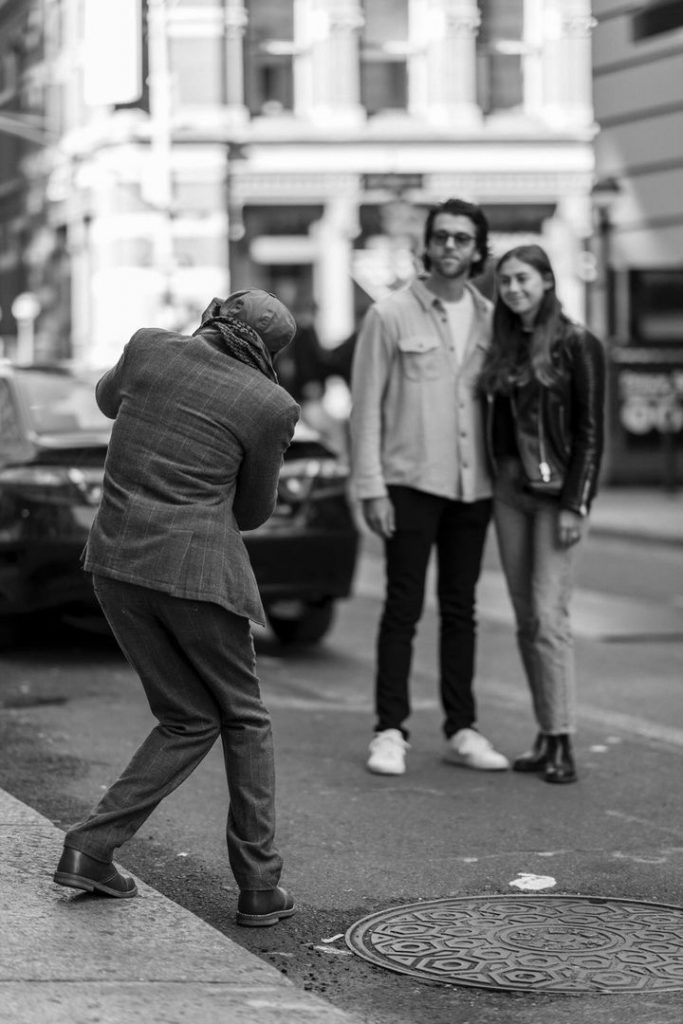 Jean-Andre Antoine Taking Photo of Passersby