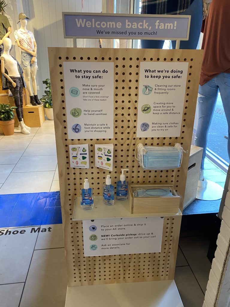 Mask and hand sanitizer set up in a store