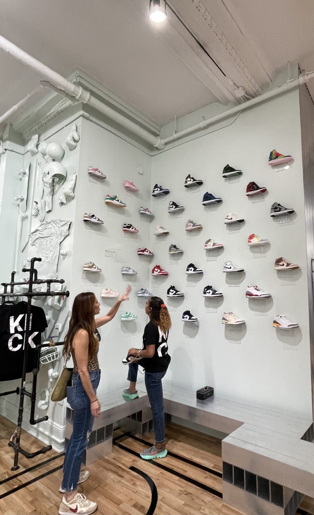 shoes on an interior display wall in kick essentials