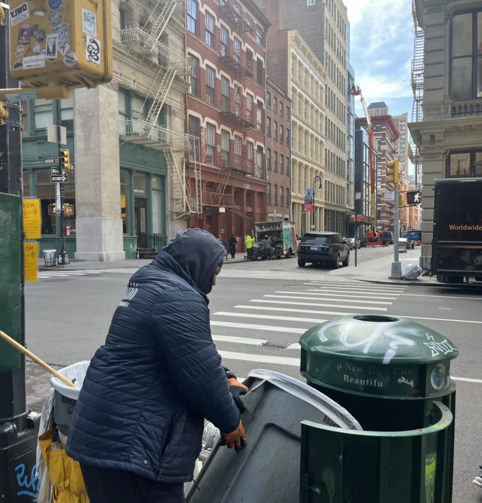 Changing trash can liner on Mercer Street