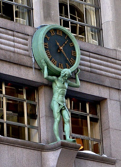 Sculpture of Atlas holding a clock outside the building of Tiffany & Co.