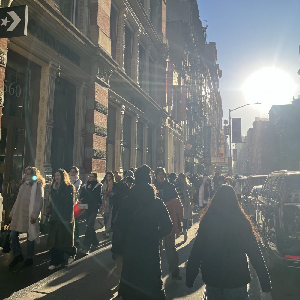 SoHo Broadway sidewalk crowded with shoppers