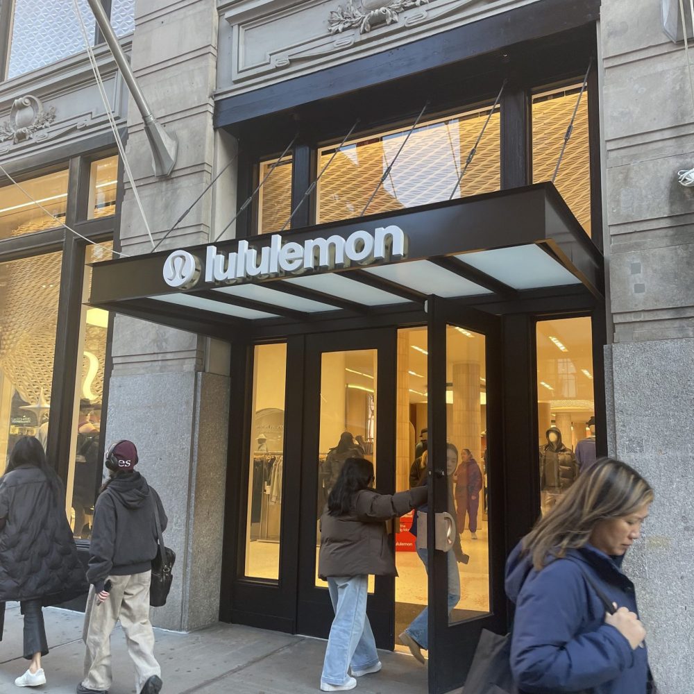 Lululemon's black awning extends over a busy sidewalk
