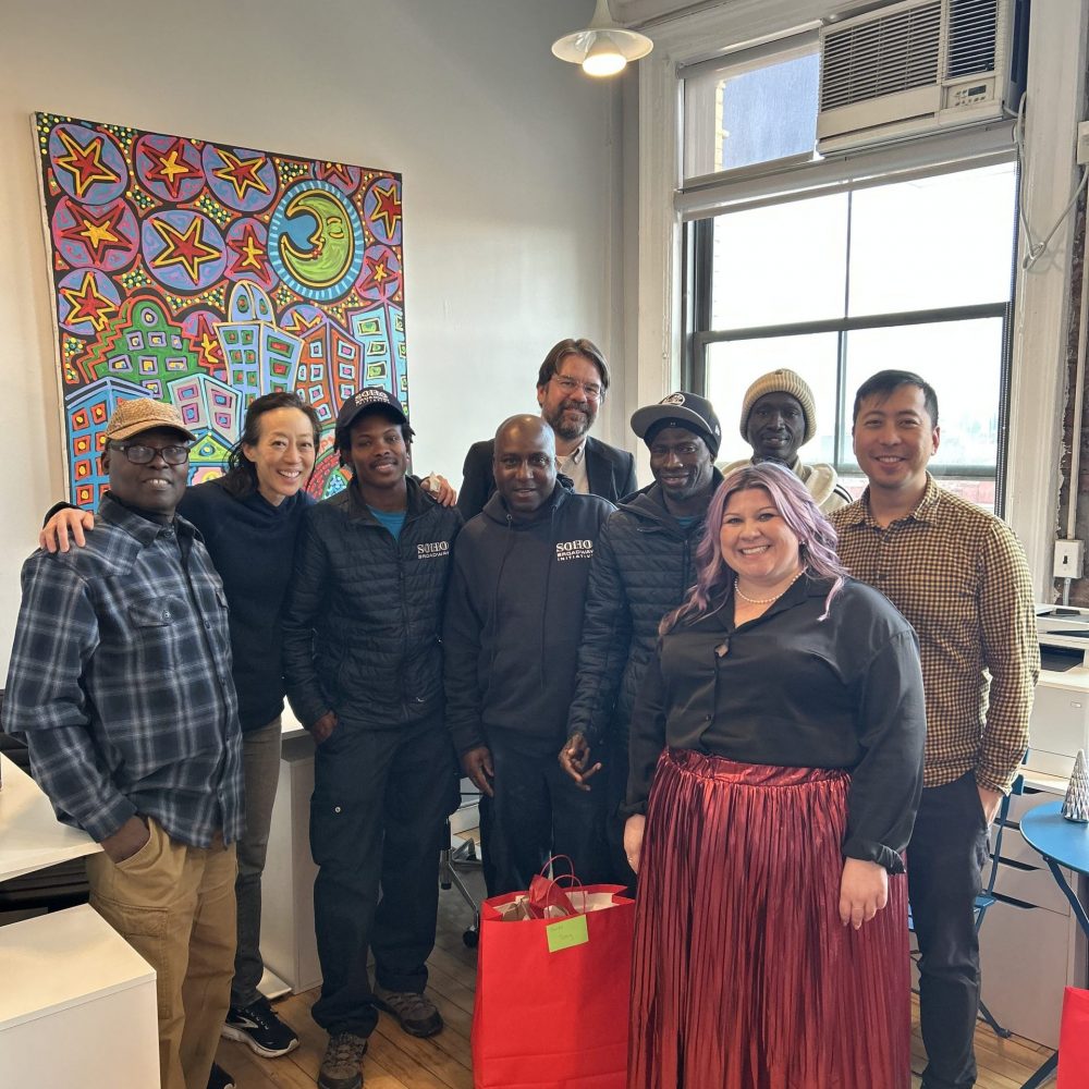 SoHo Broadway Clean Team members, staff, Board and Streetplus staff facing camera in group photo