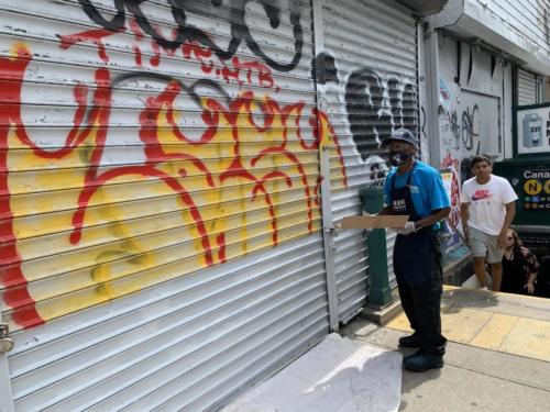 Clean Team member removing graffiti on 419 Broadway